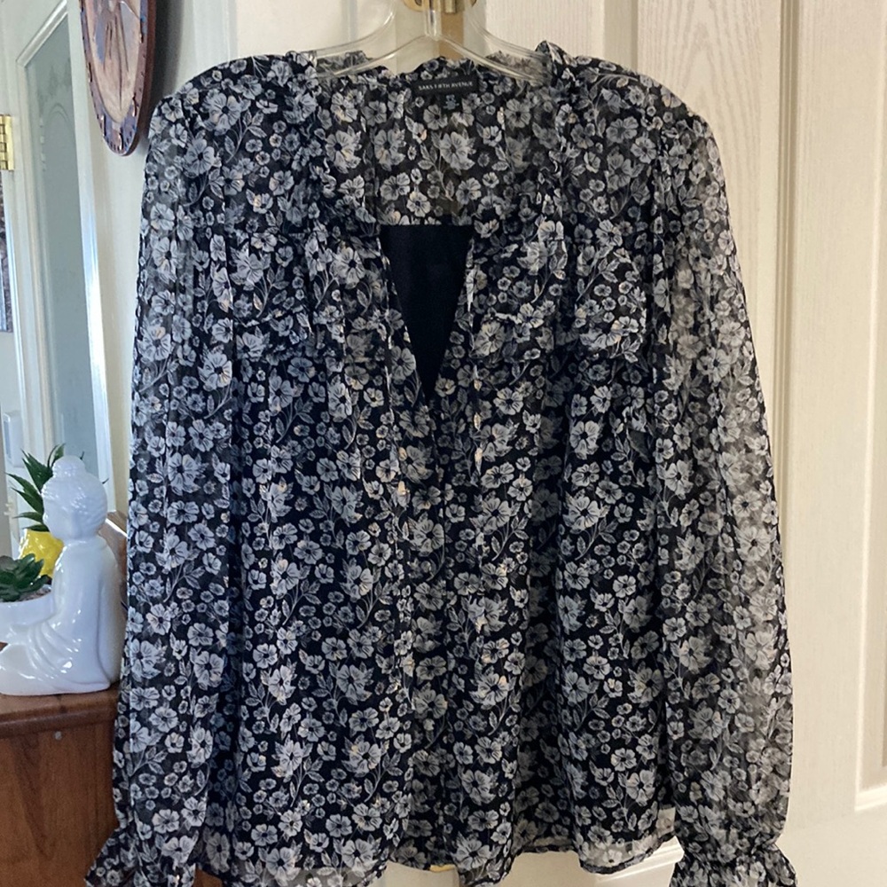 Saks Fifth Avenue blouse. Tie front, lined and ruffled neck and sleeve.